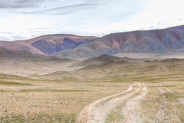 The road in the desert. Central Asia between the Russian Altai and Mongolia