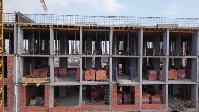 Construction site of a residential complex aerial view. Videography with a drone. Span over the construction site.