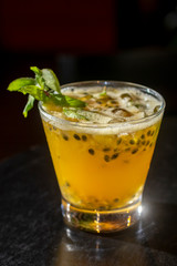 passion fruit brazilian caipirinha in glass. Typical drink made of fruit and cachaça drink