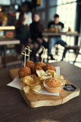 Fried Mac and Cheese balls served with ketch up, selective focus
- 341418918