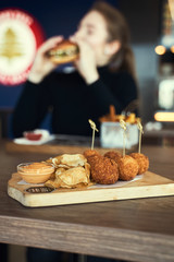 Fried Mac and Cheese balls served with ketch up, selective focus
- 341419593