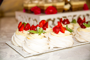 Wedding Dessert Buffet.Cupcake with swirls and flower of creamy.Sweet cookie decoration and details