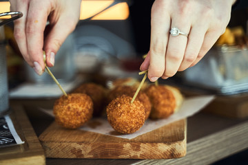 Fried Mac and Cheese balls served with ketch up, selective focus
- 341420195