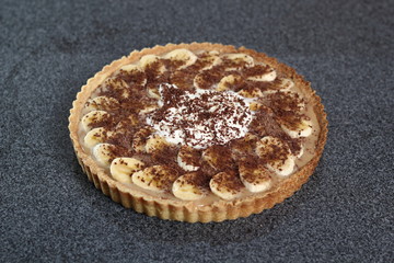 Boston Banoffee Pie. Biscuity Shortcrust Pastry with Caramel Fudge Filling and Banana Topping.