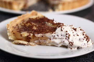Boston Banoffee Pie. Biscuity Shortcrust Pastry with Caramel Fudge Filling and Banana Topping.