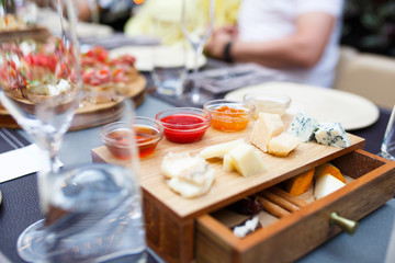 The holiday table with appetizer cheese snacks.