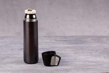 Thermos for tea or coffee with mug