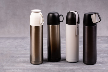 Thermos for tea or coffee with mugs on fasteners
