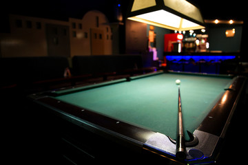 Billiard table with cue