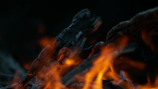 Super slow motion of flames with logs isolated on black background. Filmed on high speed cinema camera, 1000 fps