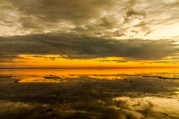 A sunset over a body of water