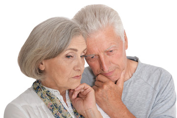 Portrait of sad senior couple isolated on white background
