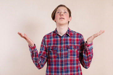 Happy young man with arms raised