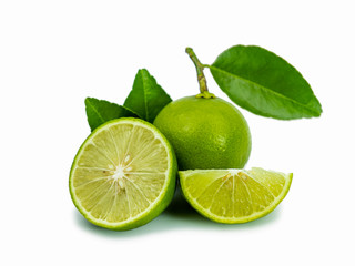 Natural fresh lime and sliced green leaf isolated on white background