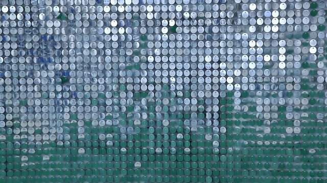 Background from sparkly sparkles sparkling in the wind. Sparkling glitter background, sequins texture bokeh with iridescent luster