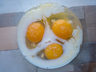 process of making omelet from natural eggs and products. Milk, salt, eggs. Cup for whipping omelet. Fork and knife. Frying pan and oil