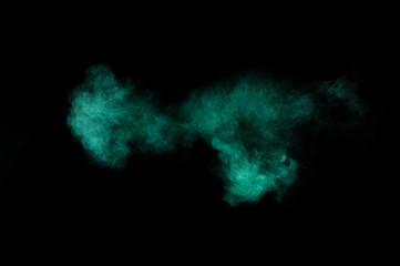 Aquamarine powder explosion on black background. Colored powder cloud. Colorful dust explode. Paint  Holi.
