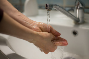 Adult woman washing hands with antibacterial soap. Hygiene concept. Prevent the spread of germs and bacteria and avoid infections corona virus - 341430959