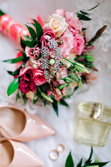 wedding rings and bouquet