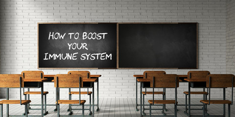 empty classroom with the text HOW TO BOOST YOUR IMMUNE SYSTEM on a blackboard