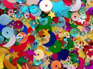 Obraz premium Mix of sequins and confetti of many colors with the shape of stars, hearts, etc.