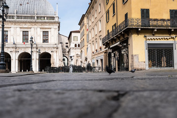 A street level view of the completely empty Loggia Square in Brescia (Lombardy, Italy).