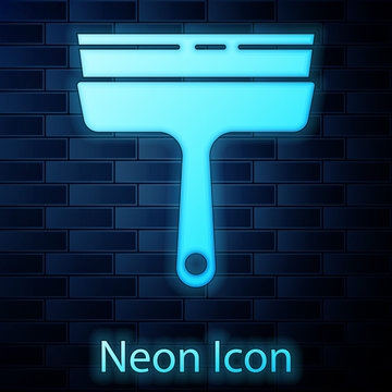 Glowing neon Cleaning service with of rubber cleaner for windows icon isolated on brick wall background. Squeegee, scraper, wiper.  Vector Illustration