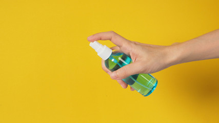 Fototapeta premium Hand is holding Alcohol Spray on white background.