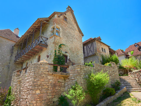 Street view of the typical houses of Saint-Cirq-Lapopie, one of the most beautiful villages in France (Les Plus Beaux Villages de France), Lot River valley, Causses du Quercy Natural Park