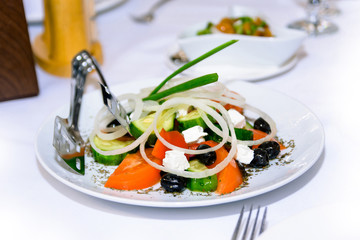 vegetables salad in a white plate on the table
