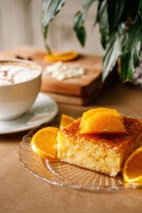 Greek special sweet pie with creamy custard, vanilla and fill soaked aromatic syrup. Authentic Mediterranean dish galaktoboureko plating photography.