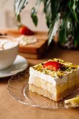 Layered of halwa topped with nuts and strawberry. Authentic Mediterranean sweet dish photography.