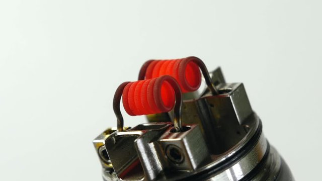 Vaping atomizer with clapton coil is working.Vape device or electronic cigarette