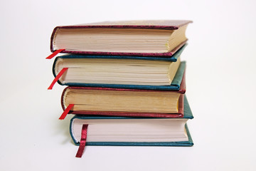 Book stack on a white background with bookmarks on classic, vintage style
