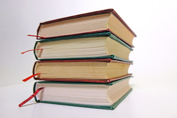 Book stack on a white background with bookmarks on classic, vintage style
