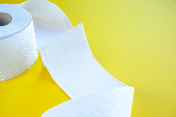 coronavirus a lot of toilet paper on a yellow background
