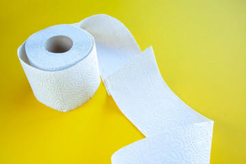 coronavirus a lot of toilet paper on a yellow background
