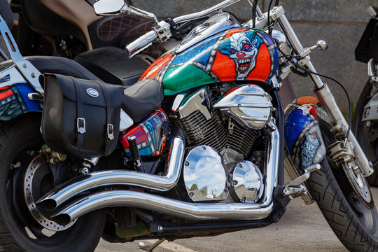 Moscow, Russia - May 04, 2019: Custom chromed and painted with airbrushing tourist motorcycle Honda in the parking closeup