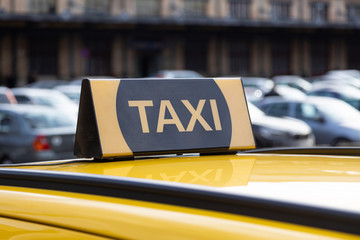 Yellow taxi icon sign in the street