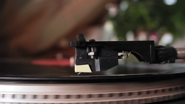 Old vintage beautiful record player playing a track with vinyl. selective focus