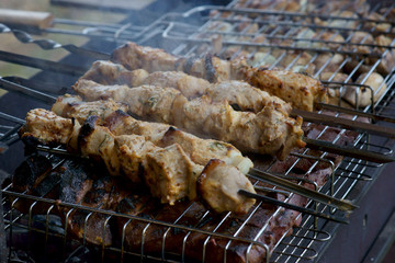 shish kebab on skewers is fried on the grill