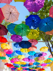 Many colorful umbrellas against sky