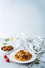 Tomato Spinach Sausage Pasta in a white plate