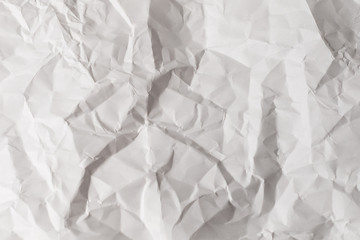 Crumpled white paper background.