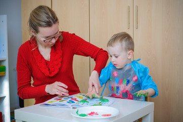 Fototapeta premium mother and son painting