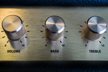 knobs of guitar amplifier in gold