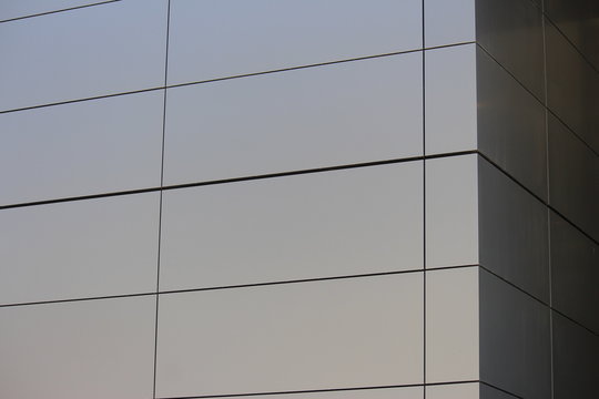 Aluminium composite cladding. The grey panel cladding is on the corner of a new building