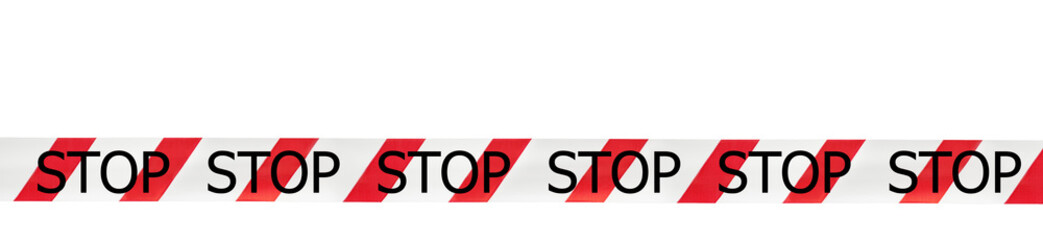 Red and white warning tape with the inscription stop  on an isolated white background. Concept for...
