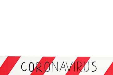 Red and white warning tape with information coronavirus on an isolated white background, the band...