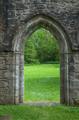 Fototapeta na wymiar Door with Gothic arch in the Inchmahome Priory remains, Scotland